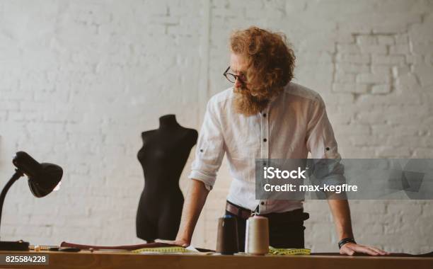 Bearded Man In Glasses Leaning Upon Table Stock Photo - Download Image Now - Leaning, Model - Object, Table