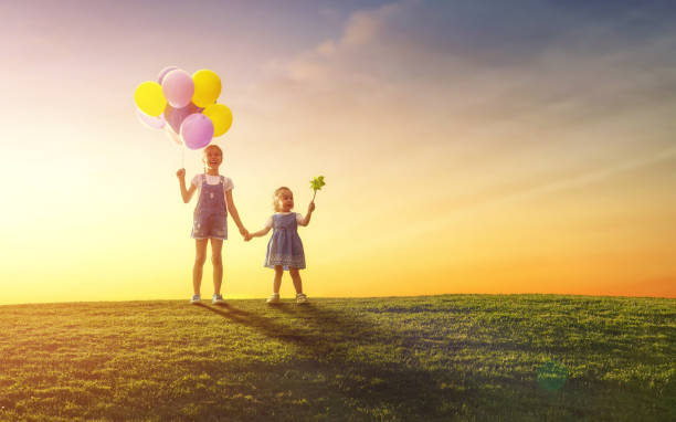 istock children are playing with balloons 825584296