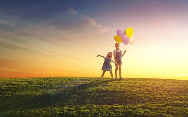 istock children are playing with balloons 825584312