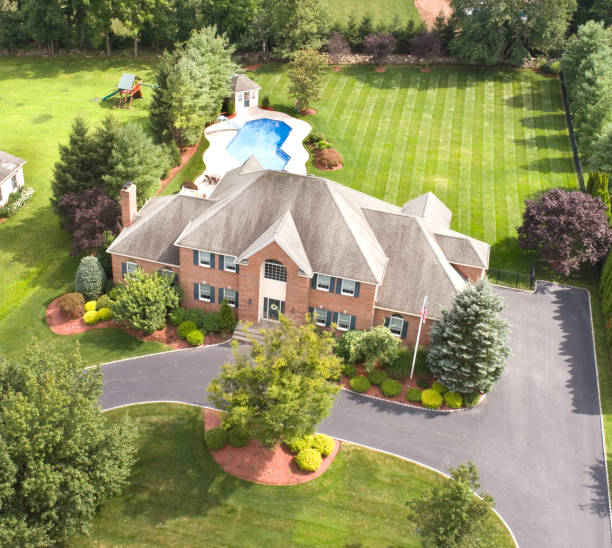 istock Large house and property aerial, house facade visible. 825584582