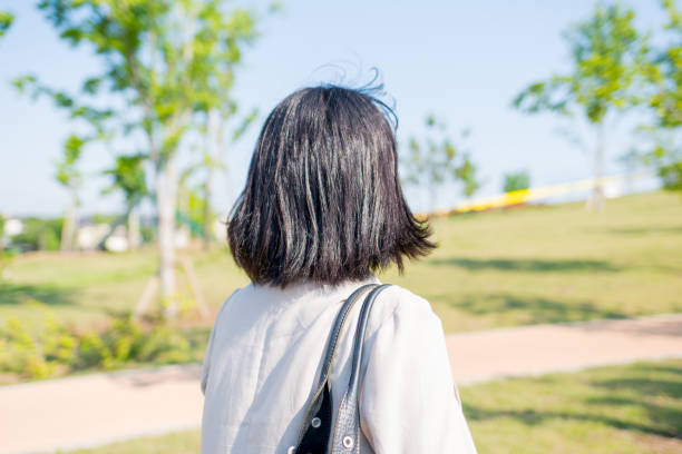 istock Businesswoman walking in the park 825586464
