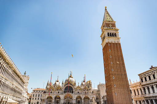 VENICE - JULY 1: San Marco square with Campanile and Saint Mark's Basilica. The main square of the old town on July 1, 2017 in Venice, Italy.VENICE - JULY 1: San Marco square with Campanile and Saint Mark's Basilica. The main square of the old town on July 1, 2017 in Venice, Italy.
