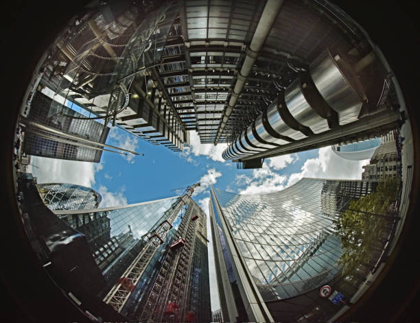A fish eye view looking up from street level in the heart of the business and finance (city) district of downtown London. Offices and iconic skyline buildings are formed into a circle