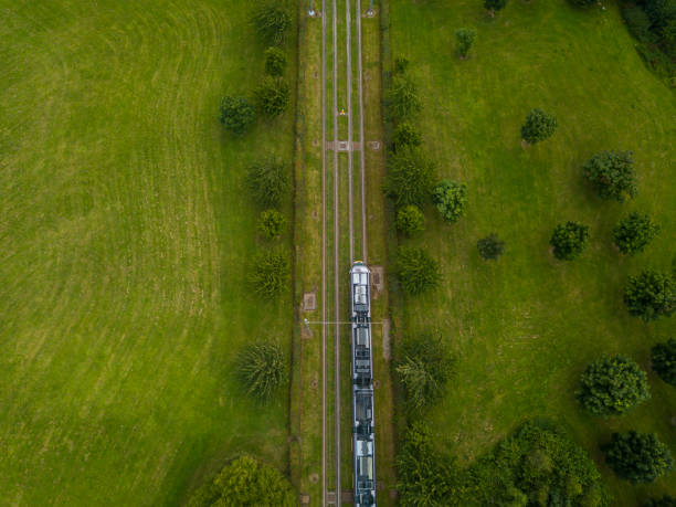 Luas tram over a rail bridge in Dublin, Ireland. stock photo