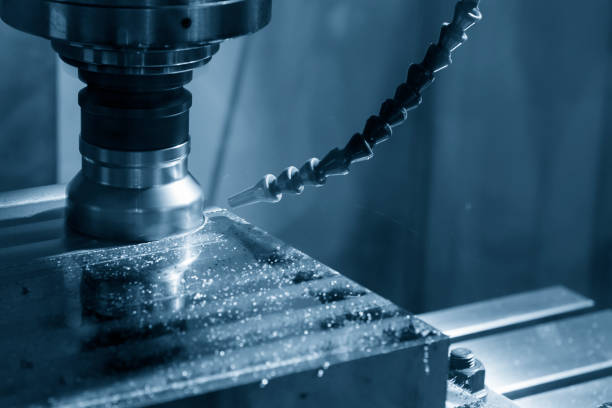 istock The CNC milling machine cutting the raw material with the index-able tool in light blue scene. 825605460