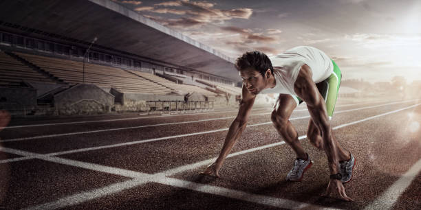 istock Sport backgrounds. Sprinter starting on the running track. Dramatic image. 825607682