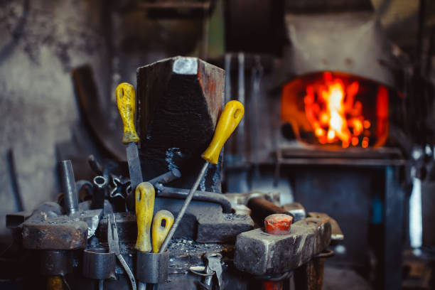 istock Fire in the furnace in the smithy, tools 825607902