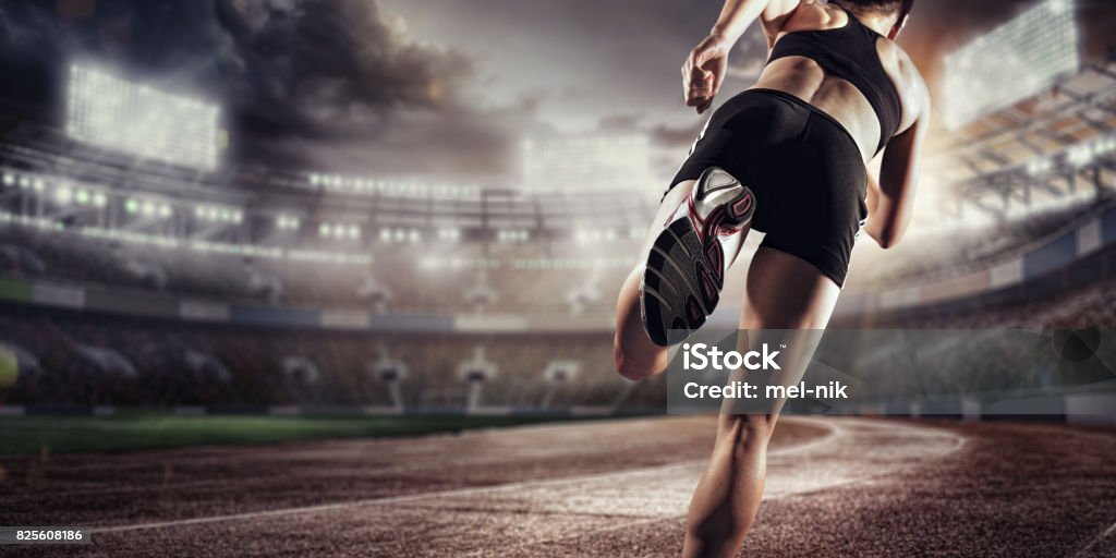 Sport background. Runner on the stadium. Dramatic scene. Back view. Sport. Runner. Starting Line Stock Photo