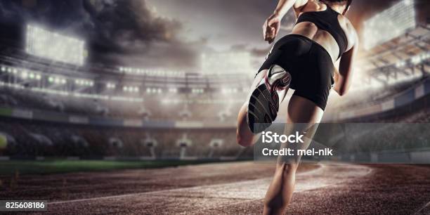 Sport Background Runner On The Stadium Dramatic Scene Back View Stock Photo - Download Image Now