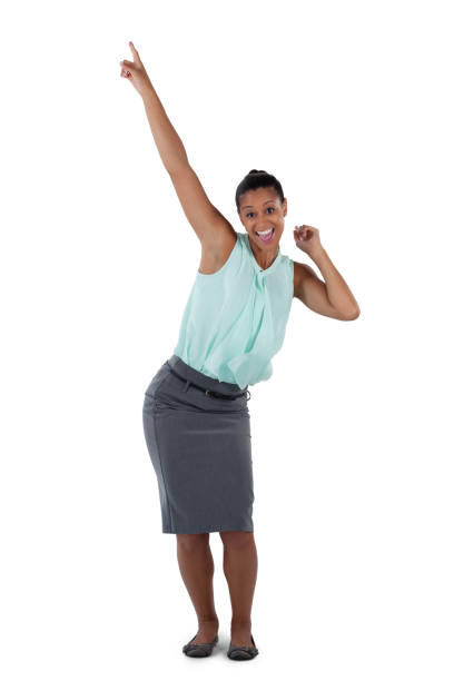 istock Excited businesswoman dancing against white background 825609034