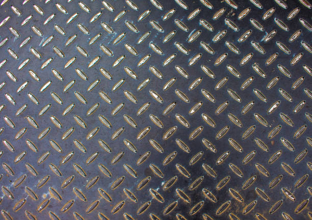 istock Metal texture. Iron floor surface photo. Metal relief for walking path in construction area. 825612296