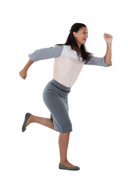 istock Businesswoman running against white background 825612502