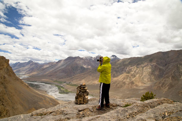 istock Man photographing rocky mountain 825616424