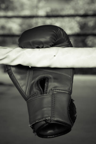 istock Old red boxing gloves on canvas 825616880