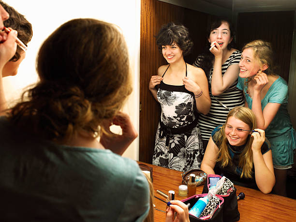 Females putting on make-up by mirror  croyde photos stock pictures, royalty-free photos & images