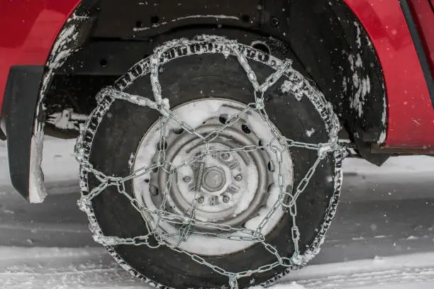 Chain tire on the car for safety driving on the snow