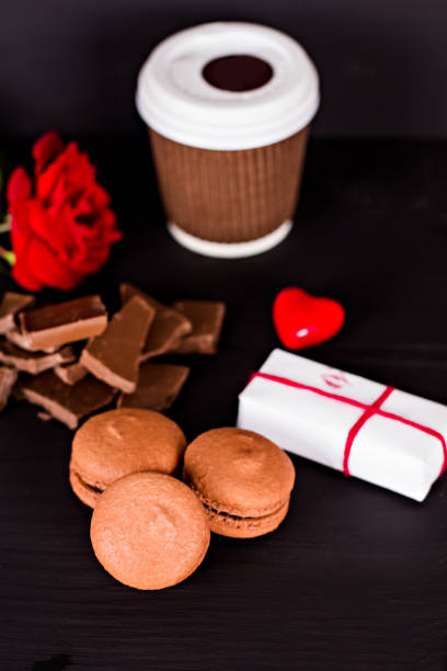 Classic French macaroons on a black background