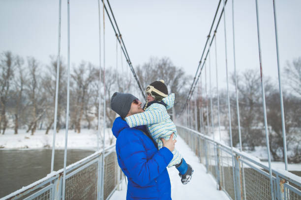 istock Father and son on the bridge 825635252