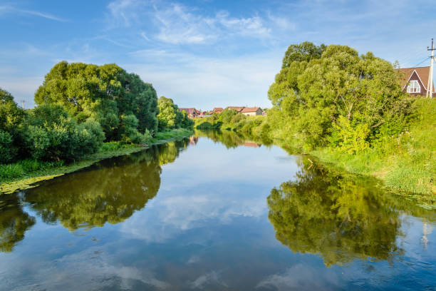 istock Reflection of blue sky in the river water. 825636382