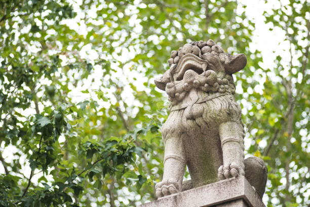 istock A single stone lion on Chinese temple roof 825643972