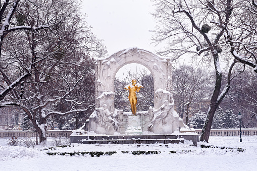 Golden monument of Johann Strauss in city park of Vienna Austria