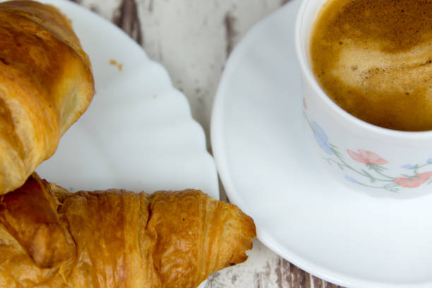 istock Delicious croissants and coffee. Selected focus. 825651672