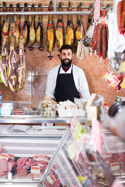 istock assistant demonstrating sorts of meat 825652468