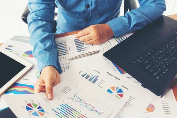 istock Businessman working and holding business graph information 825655624