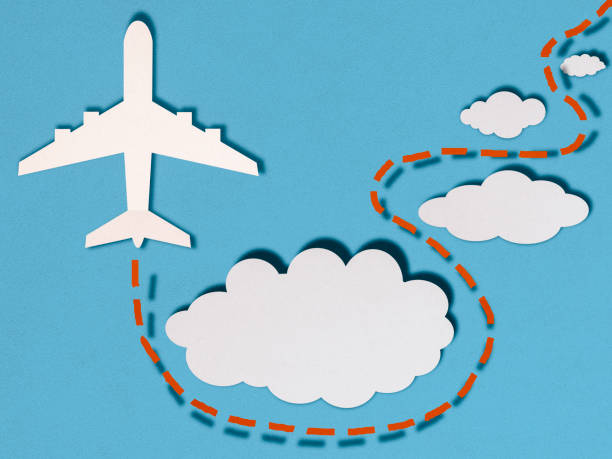 Airplane in clouds, paper cutting style stock photo