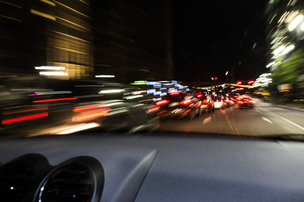 Long Exposure of Traffic and Buildings Along Detroit's Woodward Avenue A long exposure of traffic and buildings along Detroit, Michigan's Woodward Avenue, taken in the evening. woodward stock pictures, royalty-free photos & images