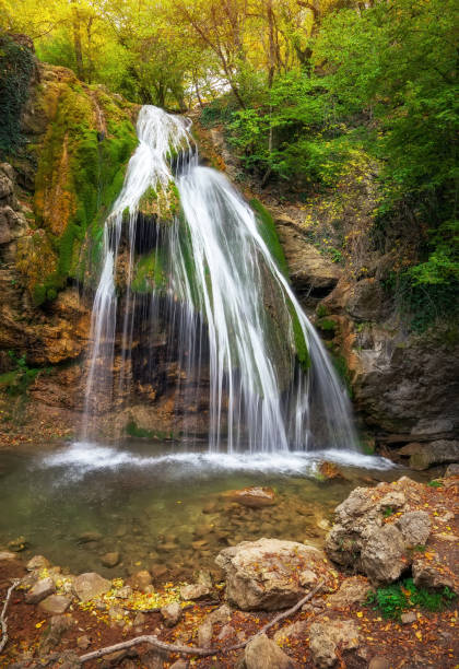 istock Waterfall Jur-Jur in Crimea. Beautiful autumn landscape 825658022