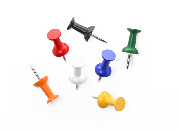 Scattered Colorful Push Pins Isolated on White Background