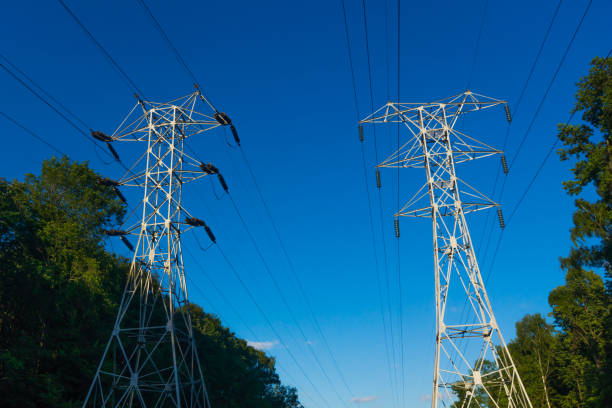 istock electricity pole, electricity pylons technology on sky background 825669622