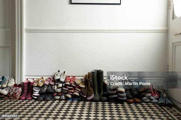 Lots Of Different Shoes Stacked In Hallway Stock Photo - Download Image Now - Shoe, Heap, Stack