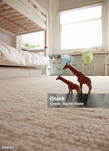 Two Toy Giraffes On Childrens Bedroom Floor Stock Photo - Download Image Now - Carpet - Decor, Flooring, Bedroom