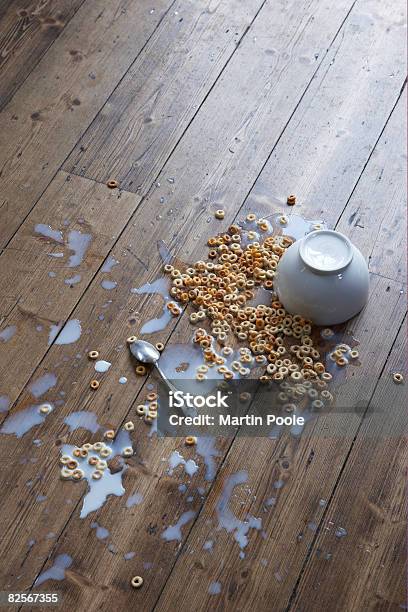 Spilled Breakfast Cereal On Floor Stock Photo - Download Image Now - Spilling, Breakfast Cereal, Milk