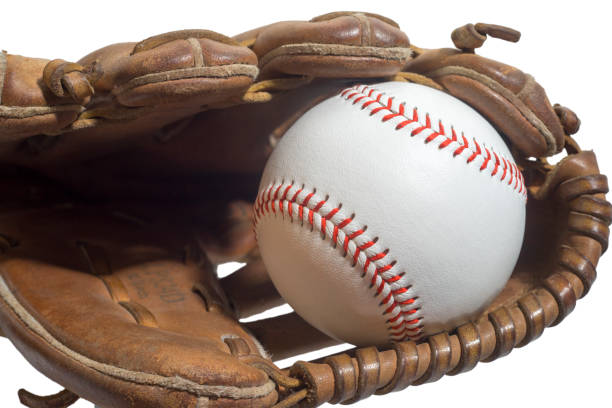 istock Old worn leather baseball glove and used ball 825673602