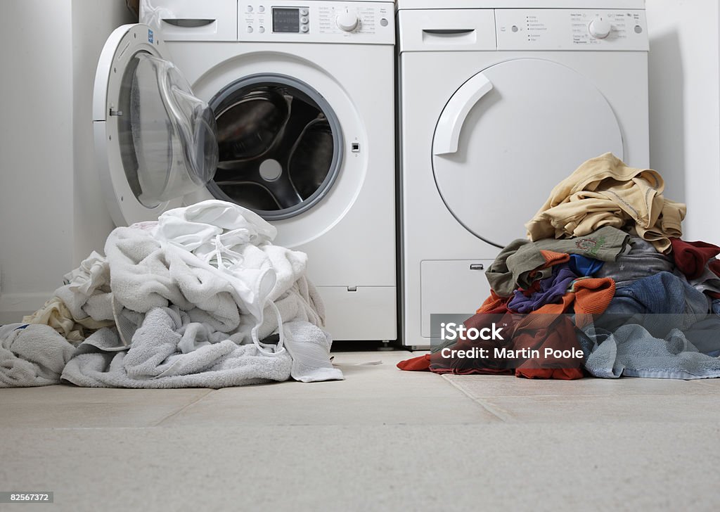 one coloured one white pile of washing  Laundry Stock Photo