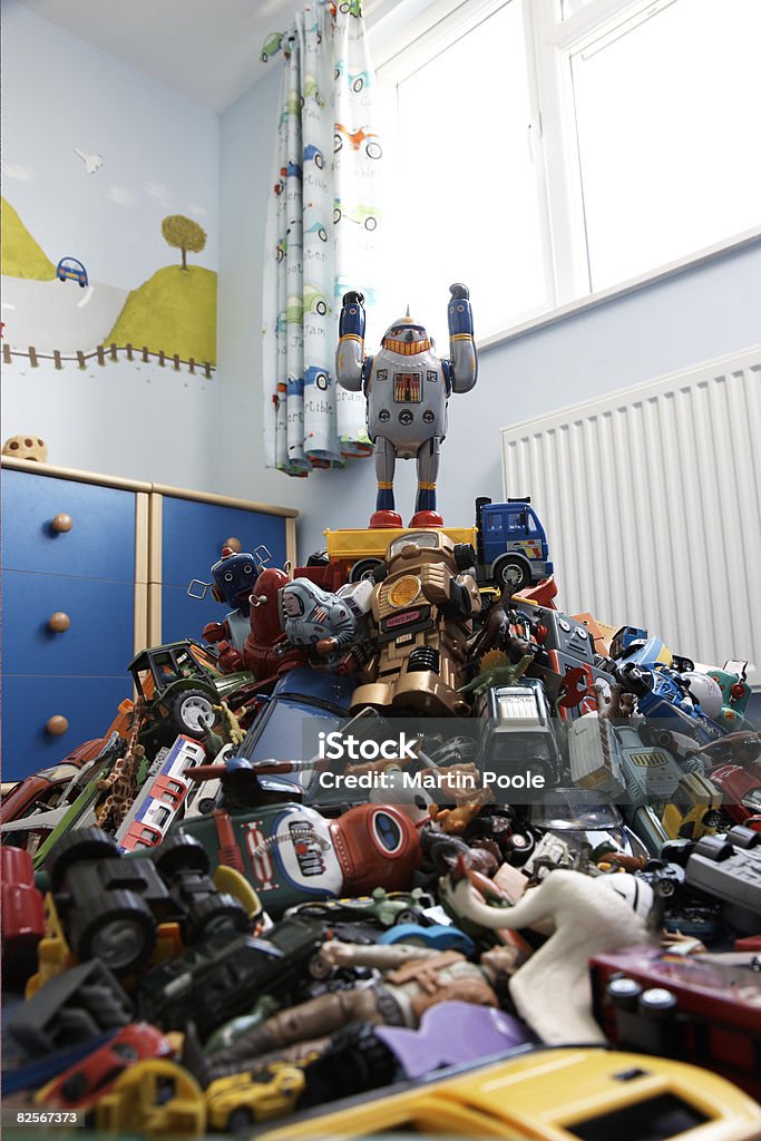 a toy robot on top of pile of ro  Toy Stock Photo