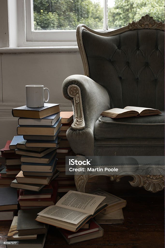 mug and pile of books   Book Stock Photo