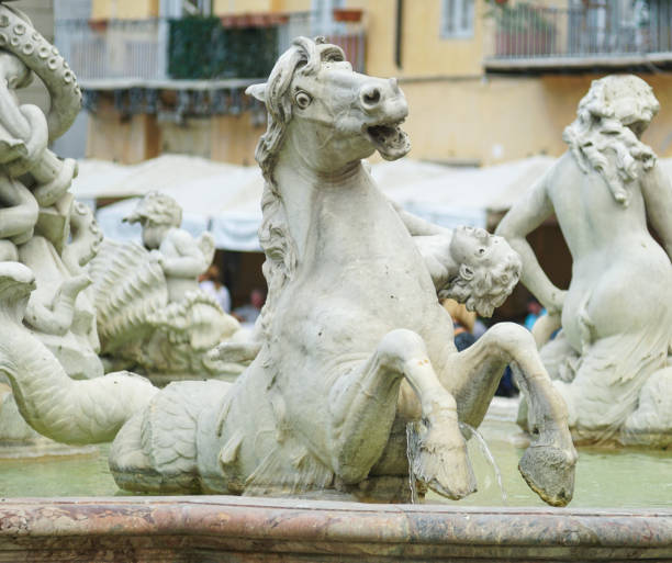 istock Statue of a horse and Cupid 825676598