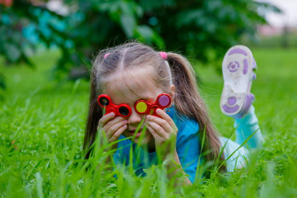 istock Little girl playing in spinner 825683498