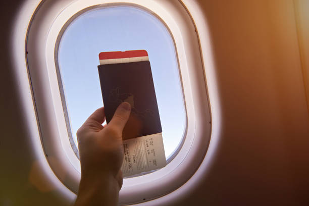 istock Airplane ticket in passport 825684458