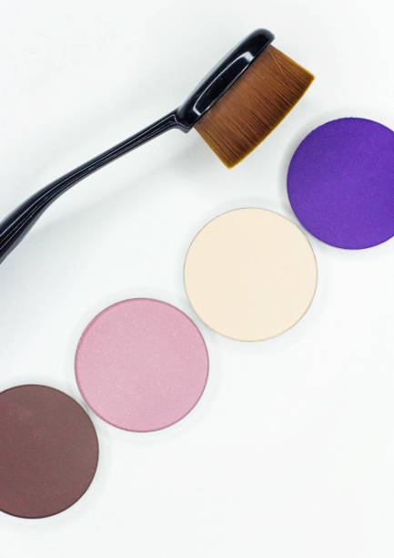 istock A new brush and eye shadow on white. 825685564