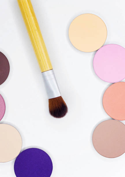 istock A new brush and eye shadow on white. 825685936