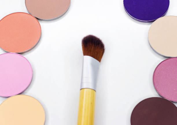 istock A new brush and eye shadow on white. 825686928