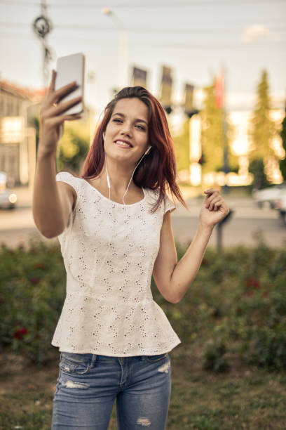 istock Young woman with smart phone. 825692728