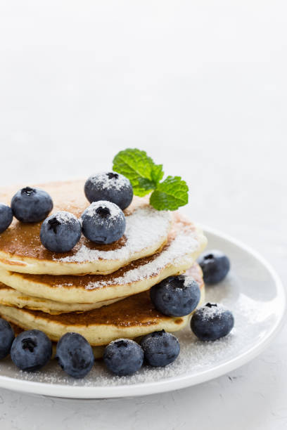 istock Blueberry buttermilk pancakes on white plate 825696444