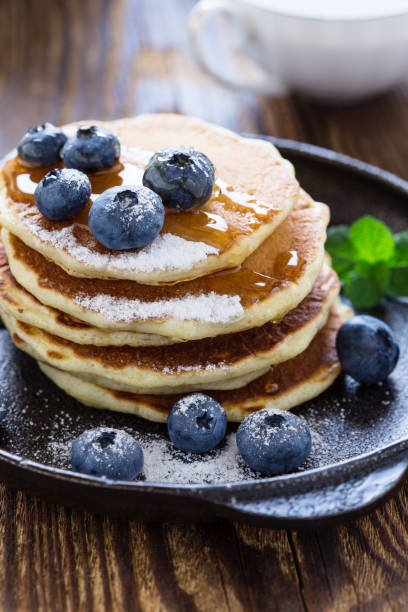 istock Blueberry buttermilk pancakes in cast iron pan 825698108