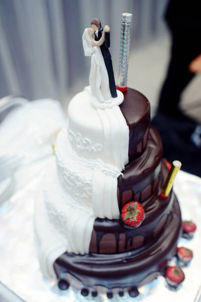 istock Beautiful wedding cake for bride and groom indoors 825701030